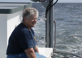 Gloria sitting on the aft deck boxes.