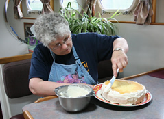 Making a birthday cake on the Coastal Messenger.