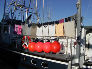 Hanging laundry to dry on the Coastal Messenger.