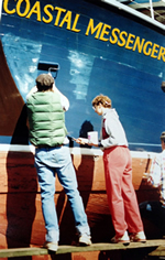 Stripping and repainting the Coastal Messenger hull.