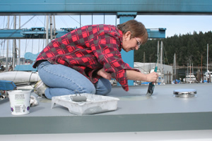 Painting the top of the aft companionway.