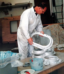 Roy Getman assembling portholes for Coastal Messenger.