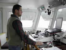 Tom running vessel on rainy day.