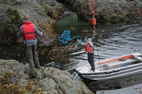Using the Coastal Messenger skiff to visit ashore.